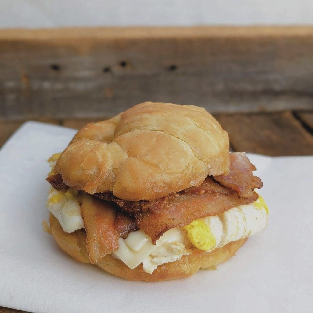 a freshly made bacon and egg sandwich