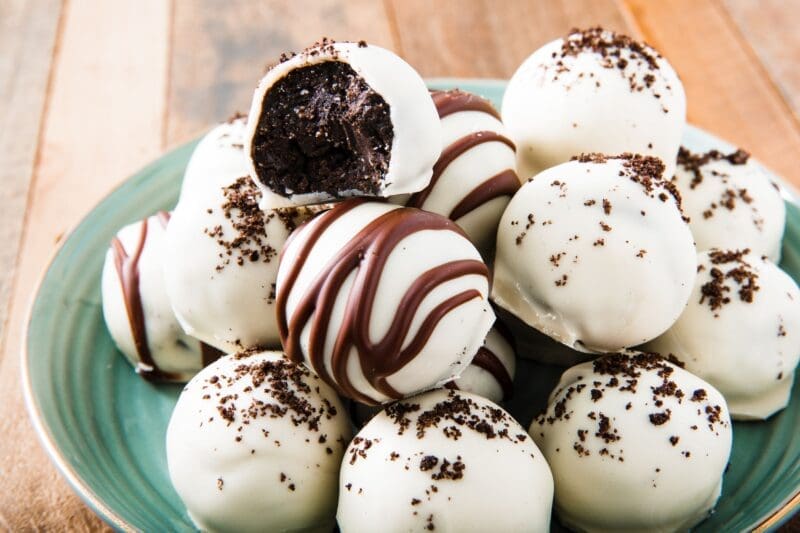 Cookies and cream truffles on a plate.